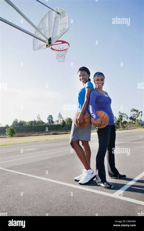 Mother And Daughter Playing Basketball Stock Photo Alamy