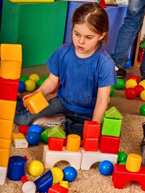 Children Building Blocks In Kindergarten Group Kids Playing Toy Floor