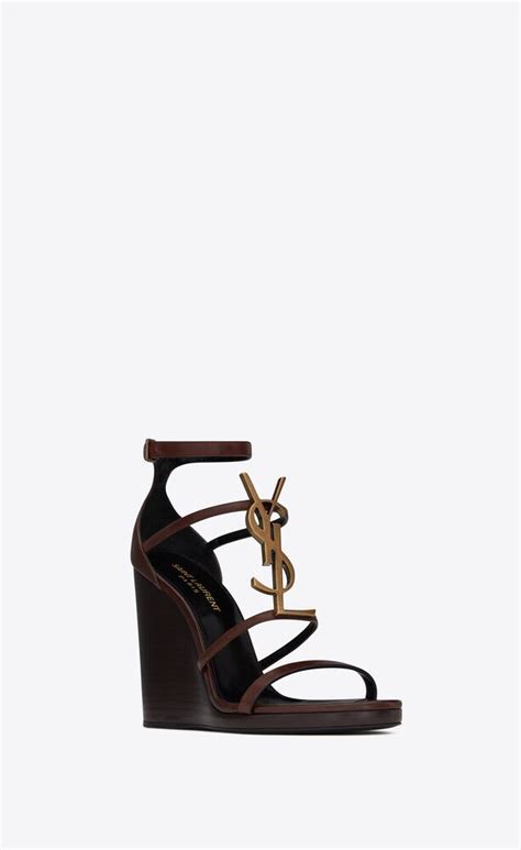 cassandra wedge sandals in smooth leather with gold tone monogram saint laurent united states