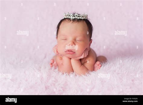 Portrait Of Nine Day Old Sleeping Newborn Baby Girl She Is Wearing A