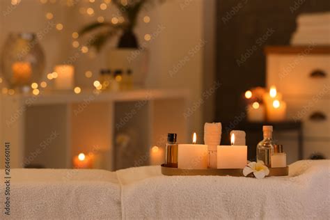 Cosmetics And Burning Candles On Massage Table In Spa Salon Space For Text Stock 写真 Adobe Stock