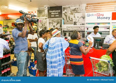African Cashier and Customer at Checkout at Local Pick N Pay Grocery