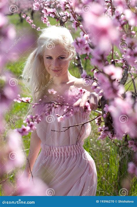 Young Pretty Blond Woman In Blooming Garden Stock Photo Image Of