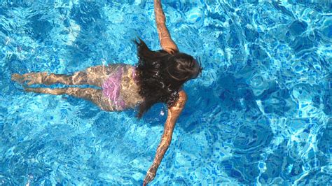 Unrecognizable Beautiful Girl Floating Across The Pool Of Hotel Young Woman High Quality