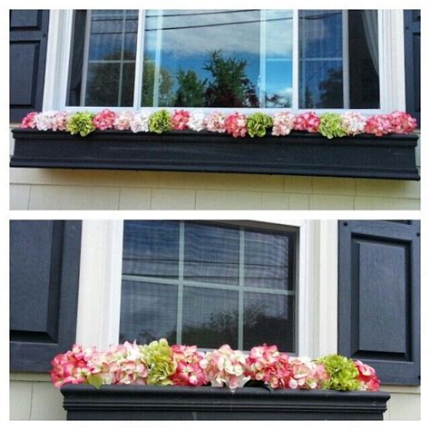 I think those are faux flowers in the window box of this pink house, but they certainly look pretty. Spring/Summer window boxes, fake flower, look real ...