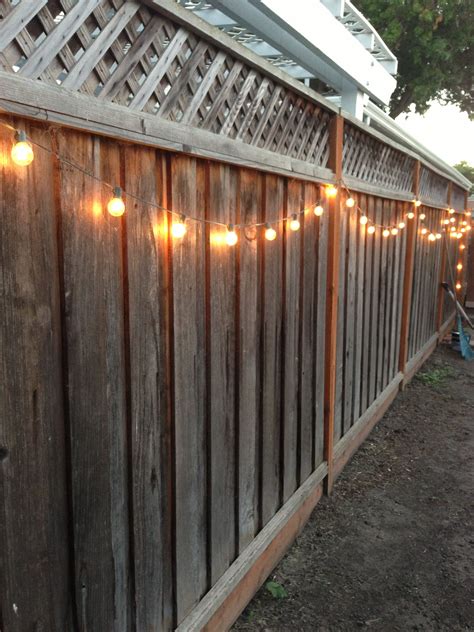 In addition to being beautiful, hanging string lights provide ample backyard lighting at nighttime and are actually. DIY backyard lighting. Hang lights on your fence! (With ...