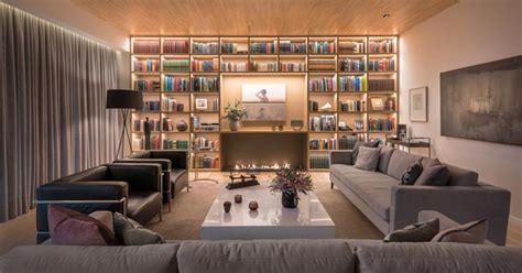 A Full Wall Of Shelving With Hidden Lighting Is A Bright Idea For This