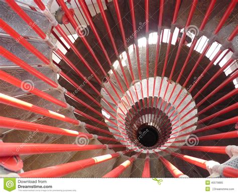 The long slender building has just six apartments per floor and two elevator cores. Red spiral staircase stock image. Image of concrete, staircase - 45579885