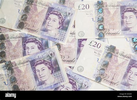 A Pile Of Used Uk Sterling Cash £20 And £10 Notes Stock Photo Alamy