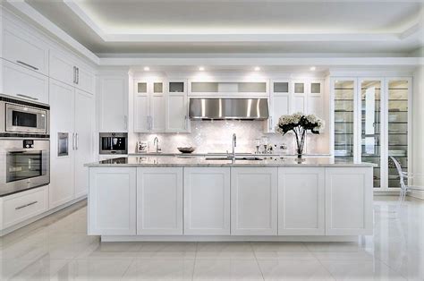 Your kitchen cabinets are a great place to refresh the look and decor of your kitchen. White shaker Kitchen cabinet design with glass door. Try ...