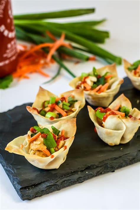 Heavy meat and vegetarian appetizers provide a satisfying and tasty substitute for a full meal, minimizing the amount of effort you must devote toward preparing the food. vegetarian wonton cups with hummus appetizer recipe