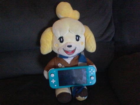 Isabelle With Her Nintendo Switch Lite By Aaronunikitty On Deviantart