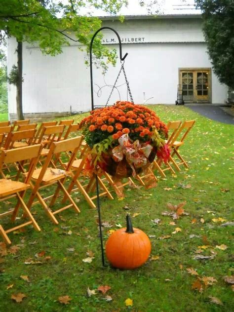 Shepherds Hook With Mums At The Start Of The Aisle Fall