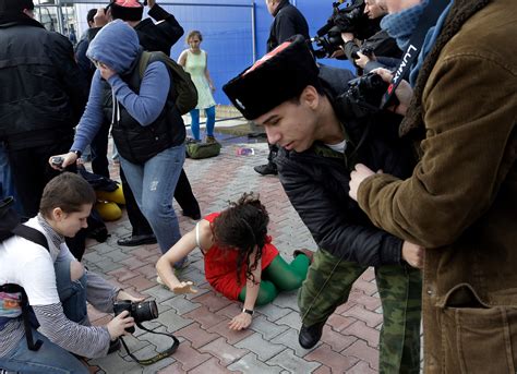 Members Of Russian Protest Group Attacked By Cossacks In Sochi The