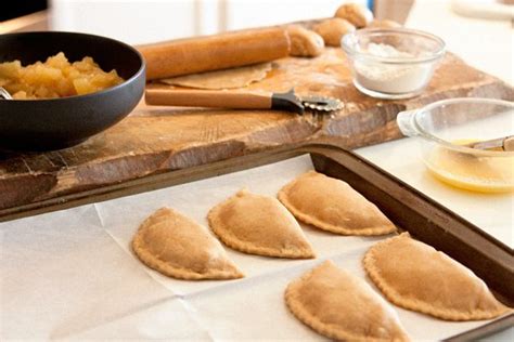 Four Pita Breads On A Baking Sheet With Butter And Cinnamon In The