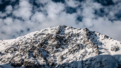 Download Wallpaper 2560x1440 Mountain Peak Snow Clouds Widescreen 16