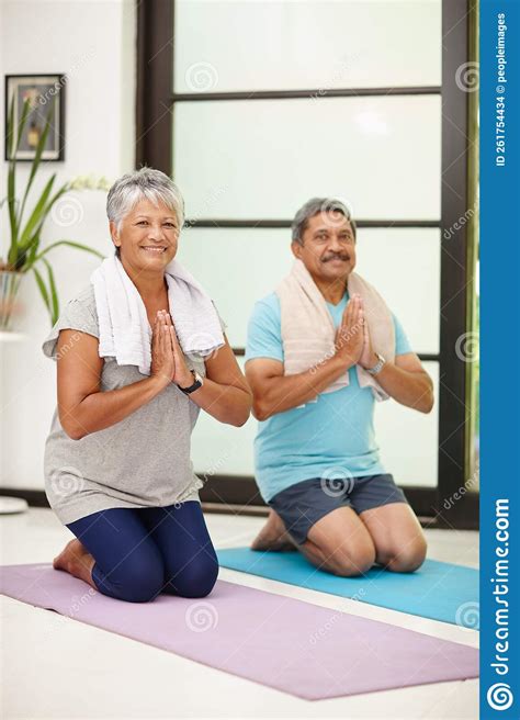 Good For The Mind And Body Portrait Of A Mature Couple Doing Yoga