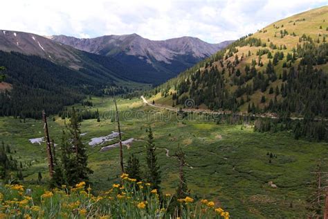 Rocky Mountain Valley Stock Photo Image Of Cloudy Yellow 100959390