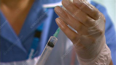 Nurse Filling Syringe With Liquid Stock Video Clip K0014010