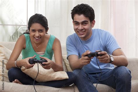 Brother And Sister Playing Video Game Stock Photo Adobe Stock