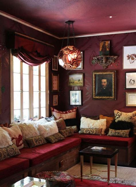 Bohemian Style Sitting Room With Burgundy Walls And Garnet