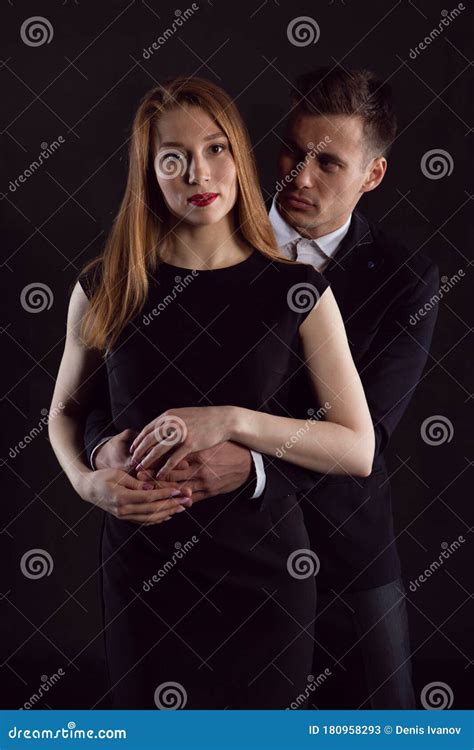 A Man Looks In Amazement At The Girl He Is Hugging Stock Image Image