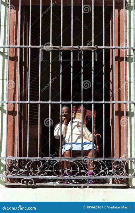 old lady looks from behind a barred window havana cuba editorial photo image of lady aged