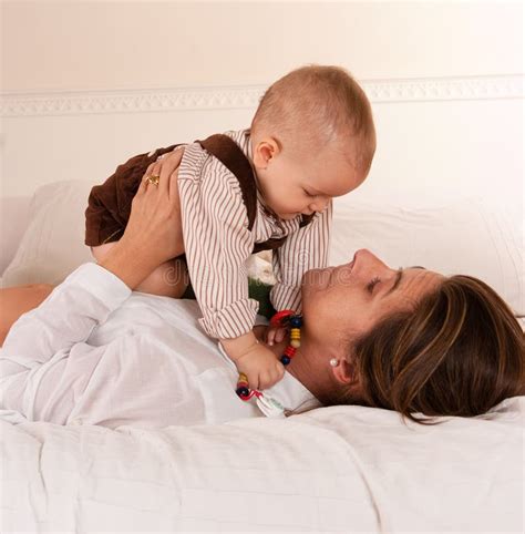 Mother Putting Talkative Son To Bed At Bedtime Stock Image Image Of Devotion Putting 6602899