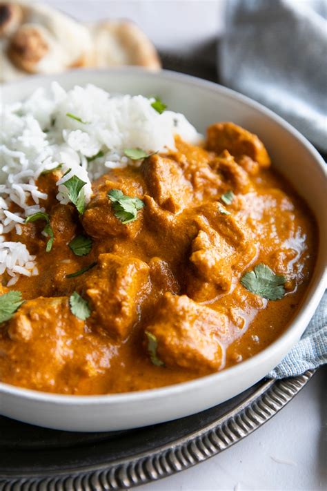 Season with salt and black pepper, add the tomatoes, breaking them up with the back of a spoon, and the coconut milk, then bring to the boil. Chicken Tikka Masala Recipe - The Forked Spoon