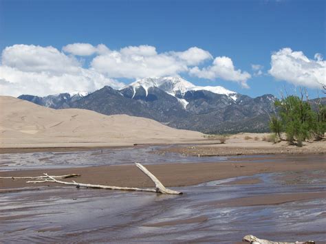 The sun sets over the sandy peaks in great sand dunes national park and preserve. Great Sand Dunes National Park and Preserve in Colorado ...