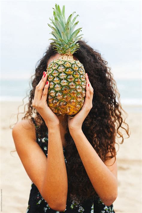 Portrait Of A Black Woman Covering Her Face With A Pineapple On The