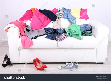 Messy Colorful Clothing On White Sofa Stock Photo 181899887 Shutterstock