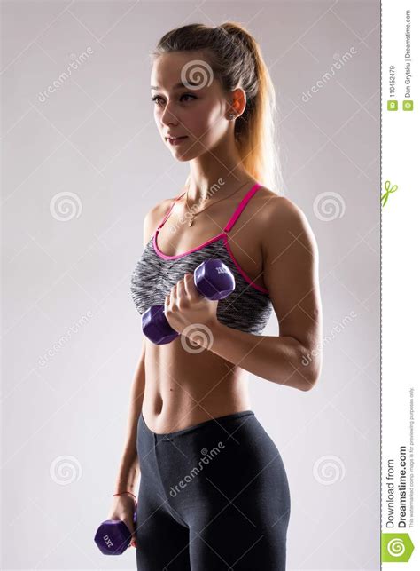 Portrait Of Young Happy Smiling Woman In Sportswear Doing Fitness
