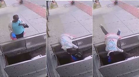 Video Woman Falls Into Open Cellar As She Was Too Busy Texting While