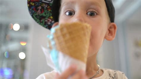 Kid Boy Eats Ice Cream Cone Licks With Tongue Stock Footage Sbv