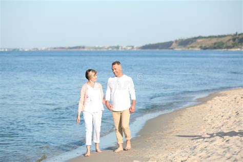 happy mature couple walking at beach stock image image of resort husband 123607463