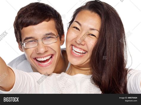 Close Up Portrait Of Young Smiling Interracial Couple