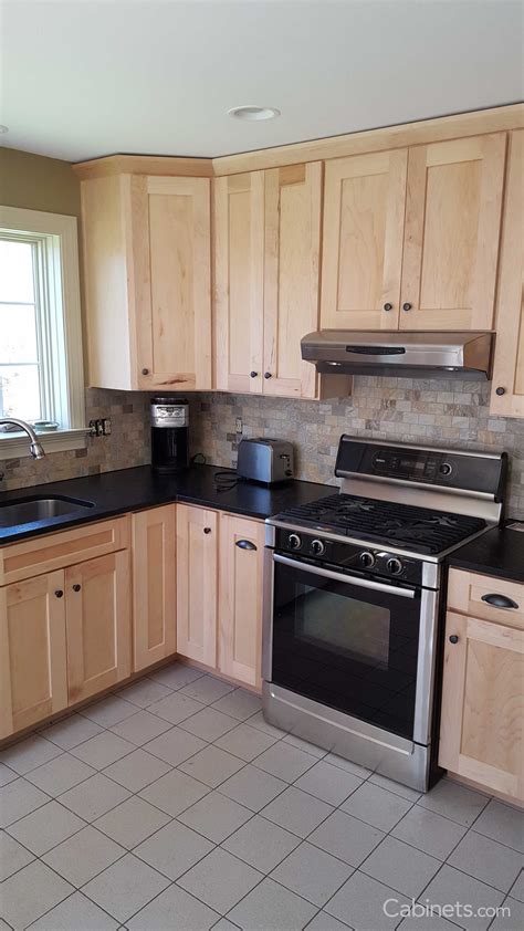They also match with the countertop and the kitchen island. Small Shaker Kitchen with Natural Stained Cabinets and ...