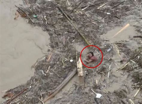 Woman Rescued After Drifting In Raging Flooding River In China