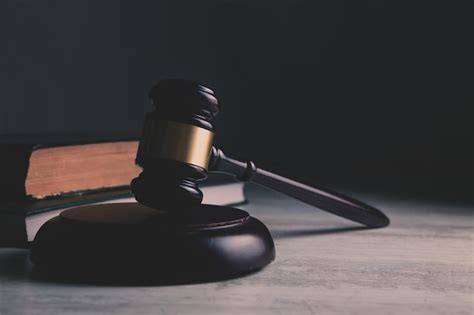 Premium Ai Image A Wooden Judges Gavel Sits On A Desk In A Court Room