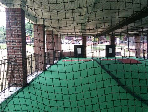 Players refine their swing in one of 14 batting cages equipped with baseball and softball pitching machines by jugs and home plate. Batting Cage Turf | On Deck Sports