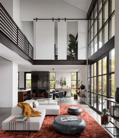 Double Height Living Area Features A Metal Framed Glass Wall And A