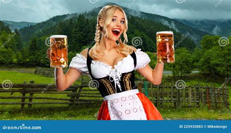 oktoberfest girl waitress with beer woman wearing a traditional bavarian or german dirndl on