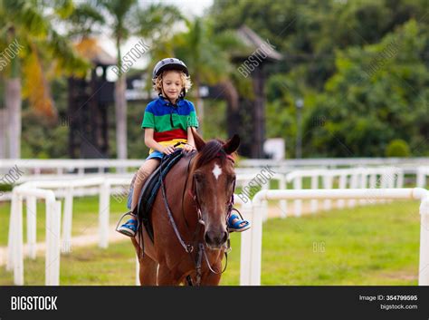 Kids Ride Horse Child Image And Photo Free Trial Bigstock