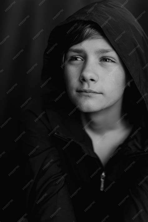 Premium Photo Black And White Portrait Of Teenage Boy On Dark
