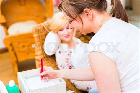 Midwife Seeing Mother For Pregnancy Examination Stock Image Colourbox