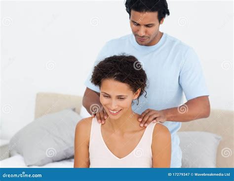 handsome man doing a massage to his beautiful wife stock image image of home massaging 17279347