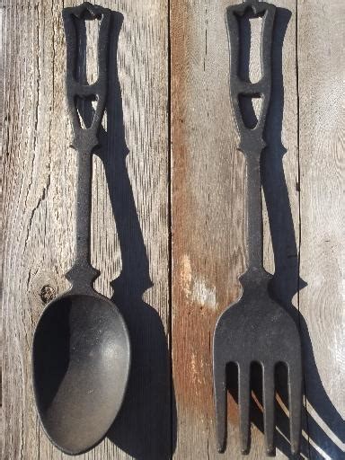Lancaster cast iron is bringing handmade tradition back to your kitchen. large spoon & fork, vintage kitchen wall art, black cast iron utensils