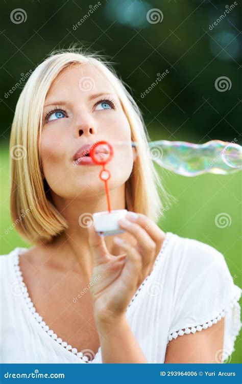 Woman Thinking And Blowing Bubbles In Nature For Fun Day Or Playing At Outdoor Park Face Of