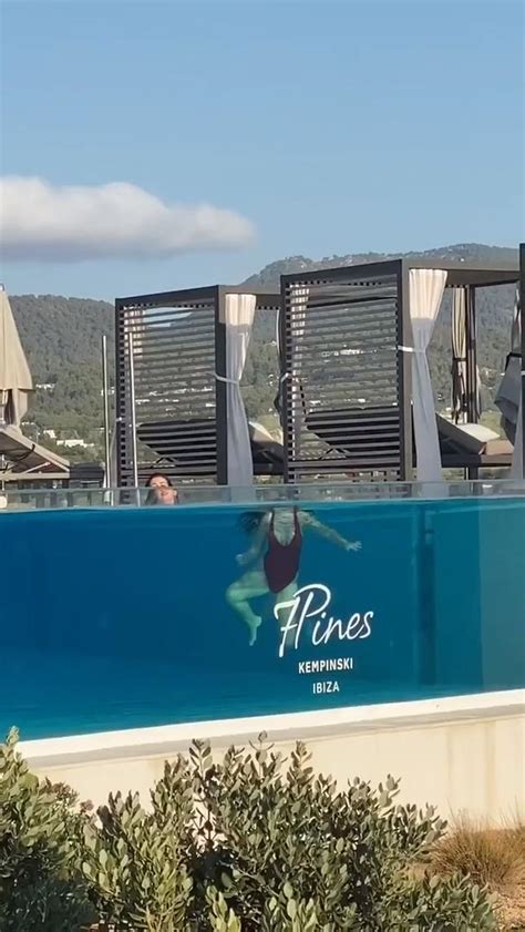 Woman Swimming In Glass Pool Gives Illusion Of Head And Body Being